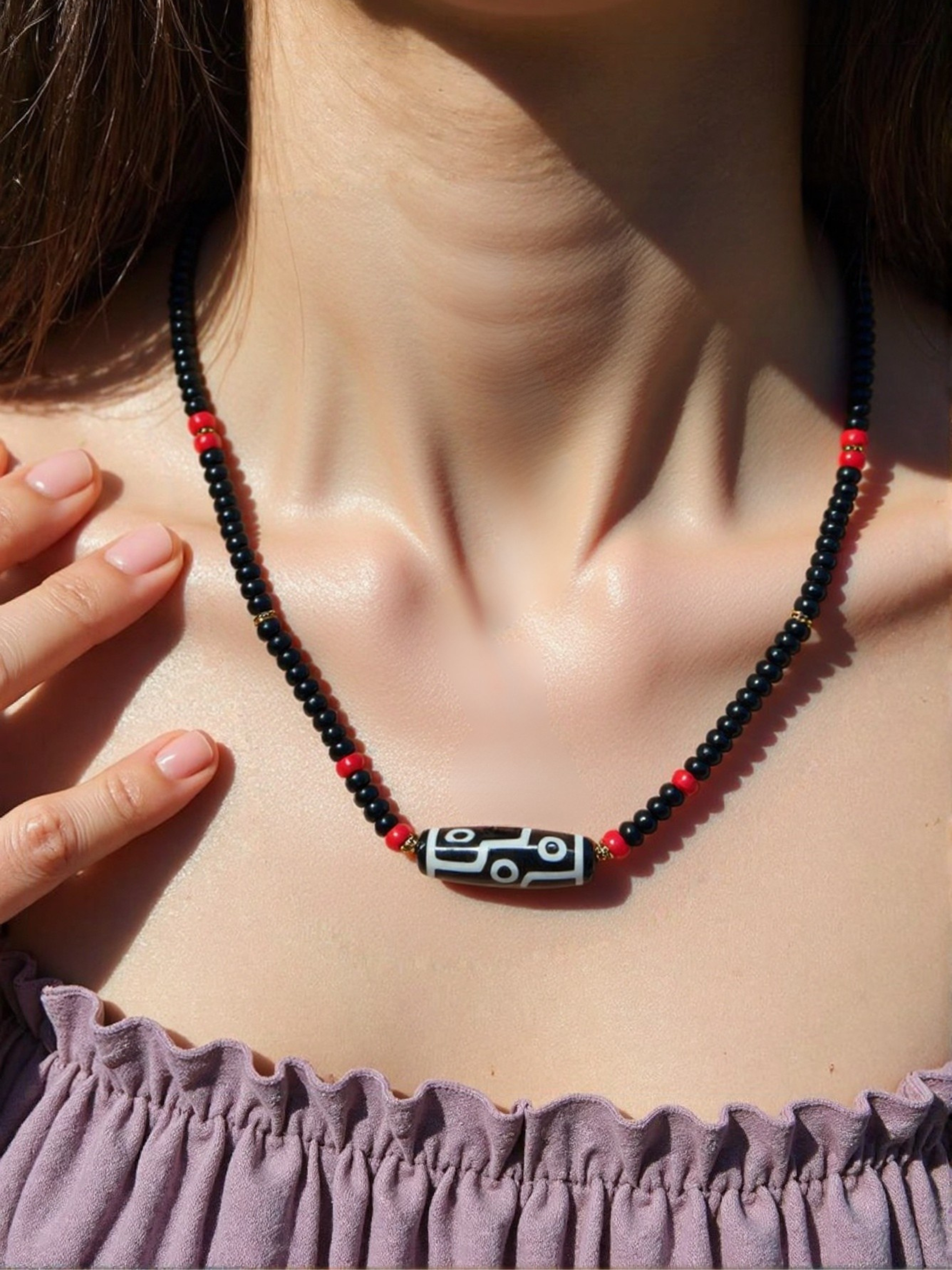 Vintage DZI necklace decorated with black and red glass beads