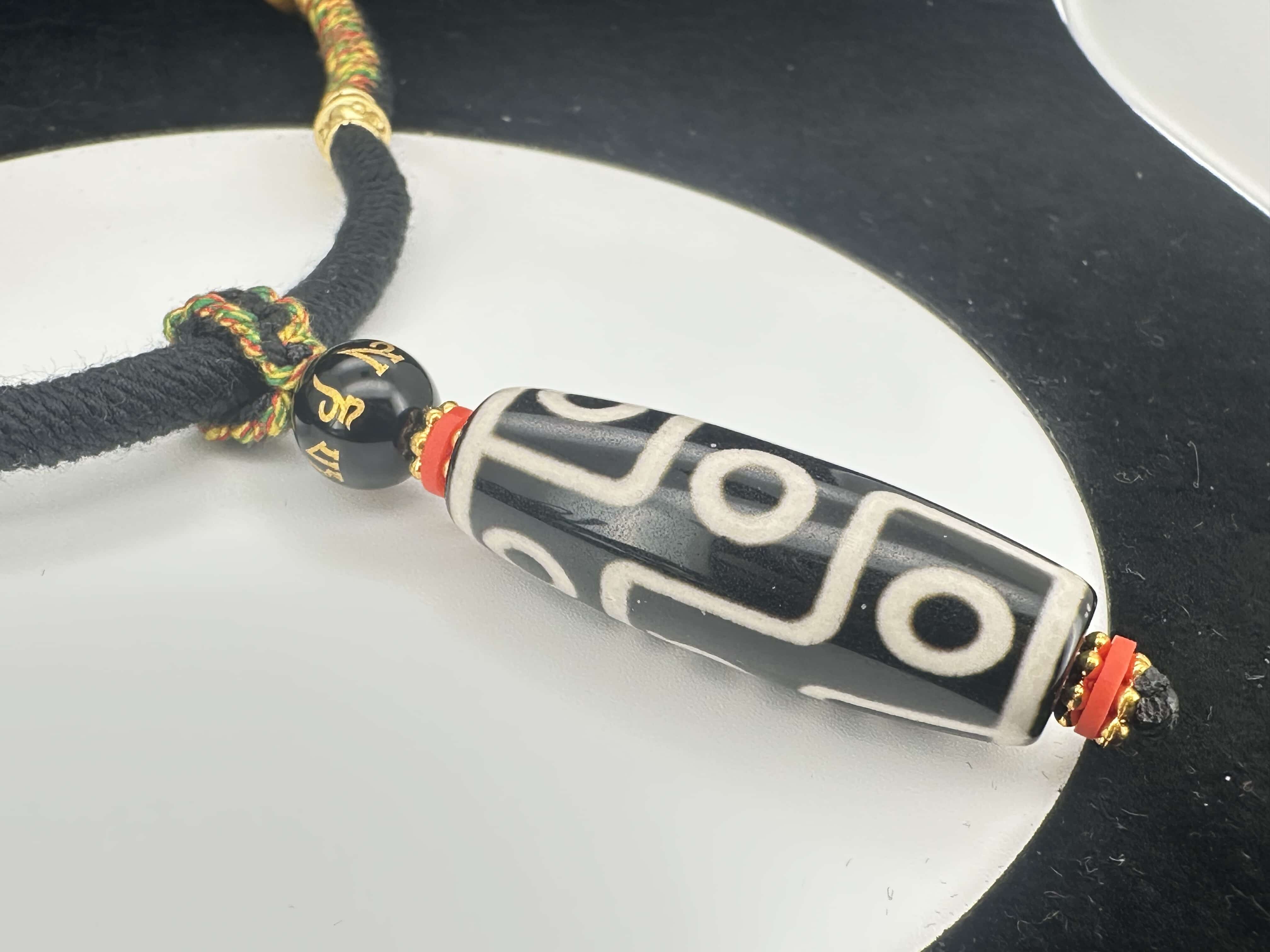 Hand wolven necklace with vintage nine eyed DZI bead