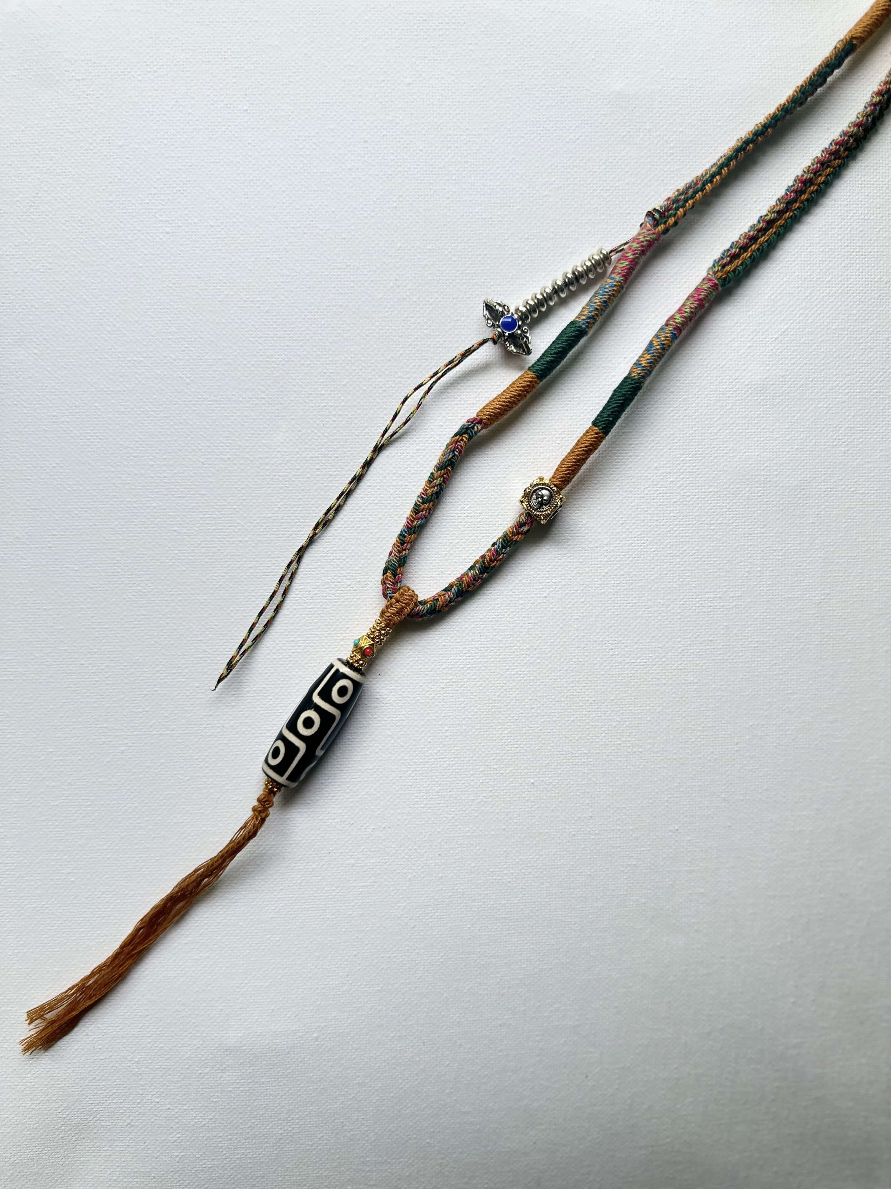 Heavily Handwoven Necklace with metal accessories and Nine-Eyed DZI pendant