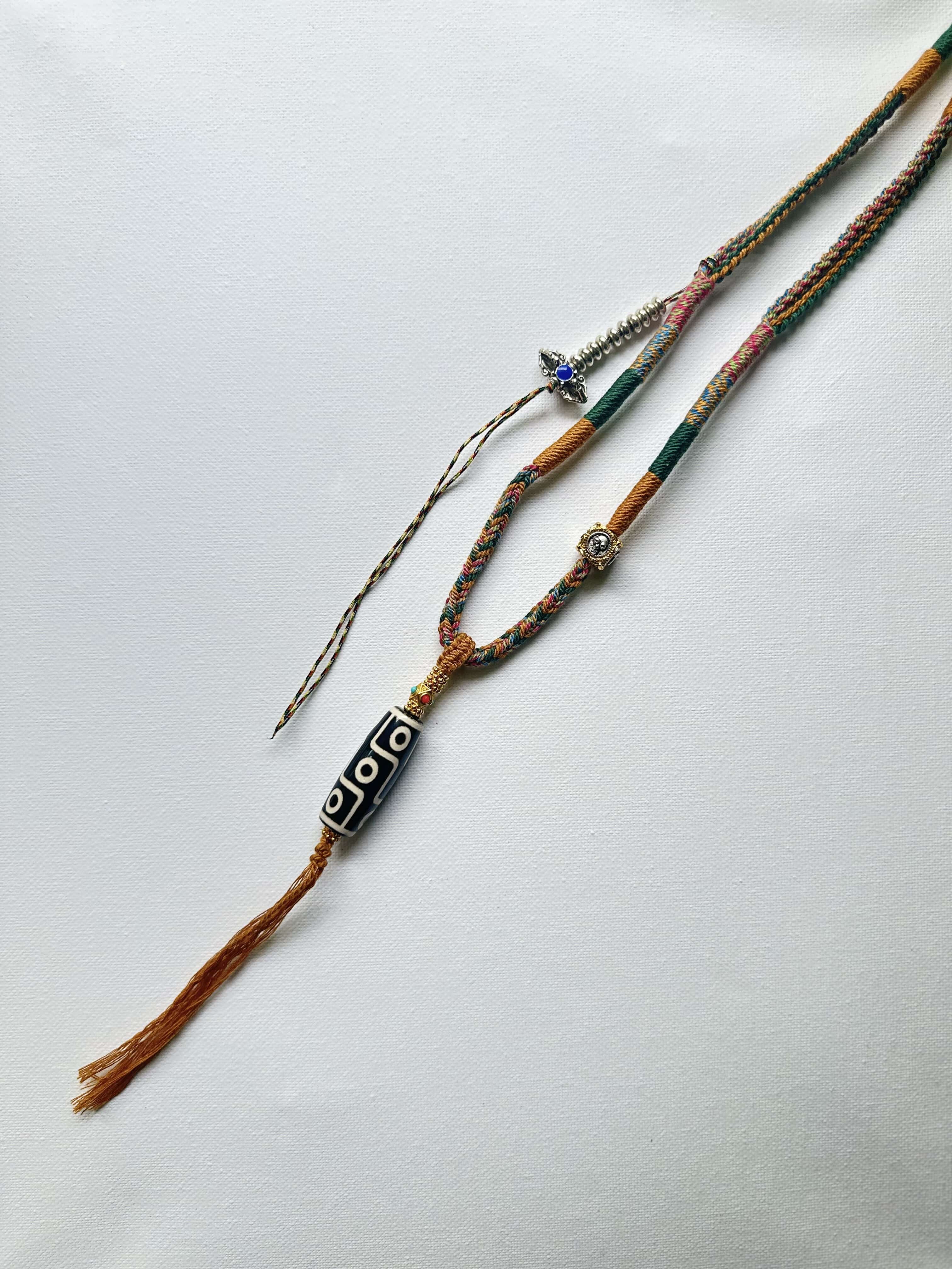 Heavily Handwoven Necklace with metal accessories and Nine-Eyed DZI pendant