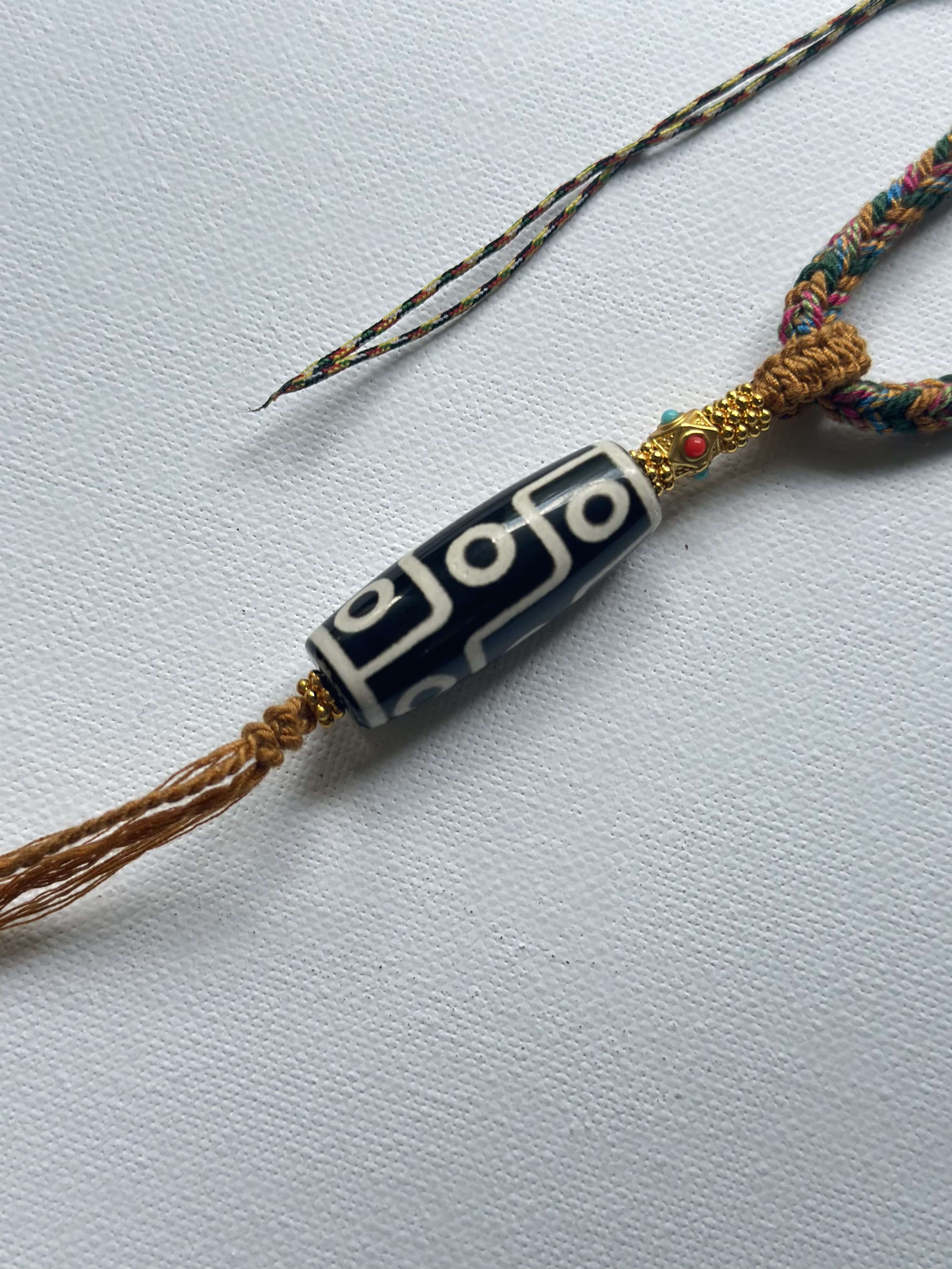 Heavily Handwoven Necklace with metal accessories and Nine-Eyed DZI pendant