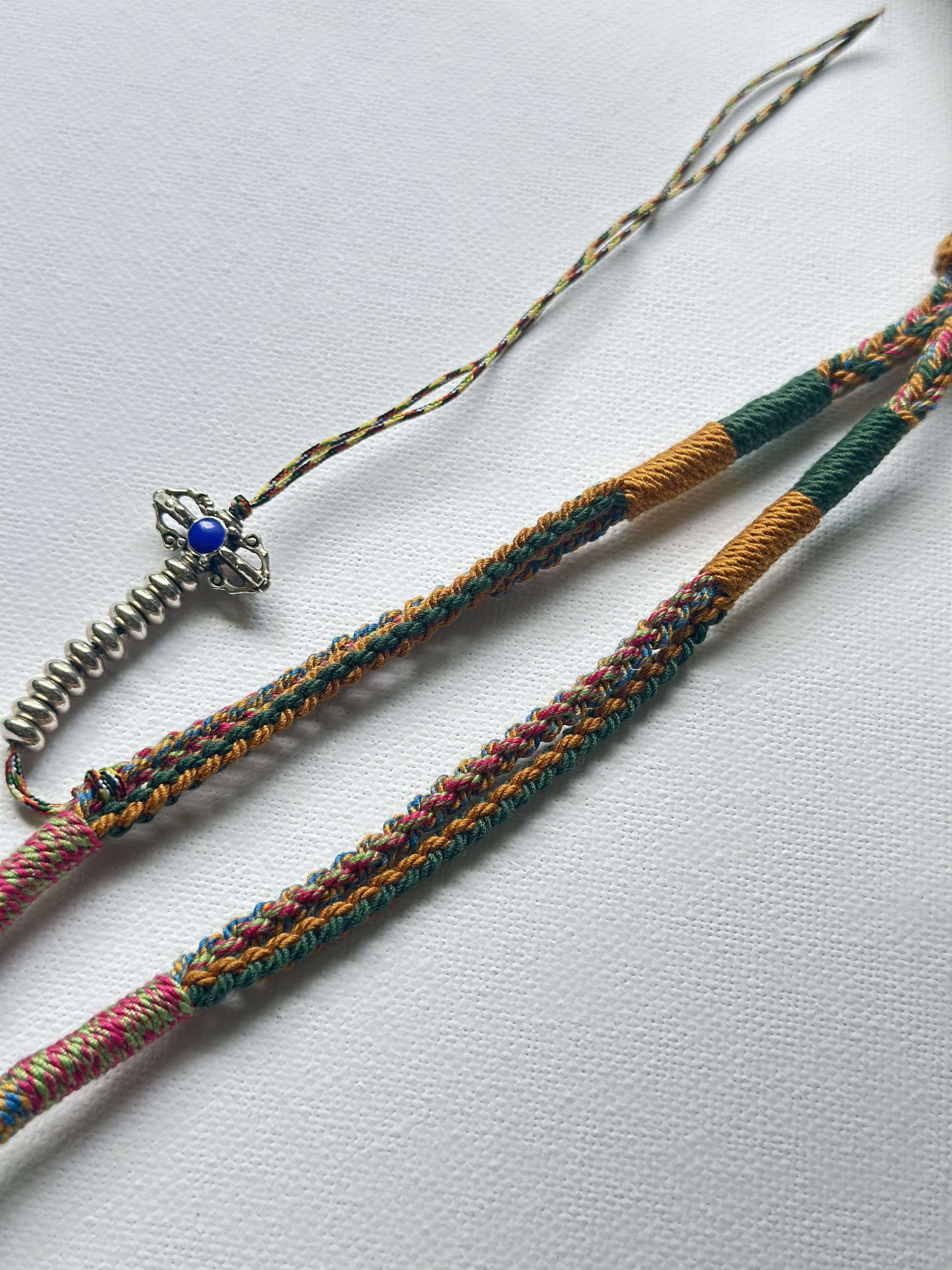 Heavily Handwoven Necklace with metal accessories and Nine-Eyed DZI pendant