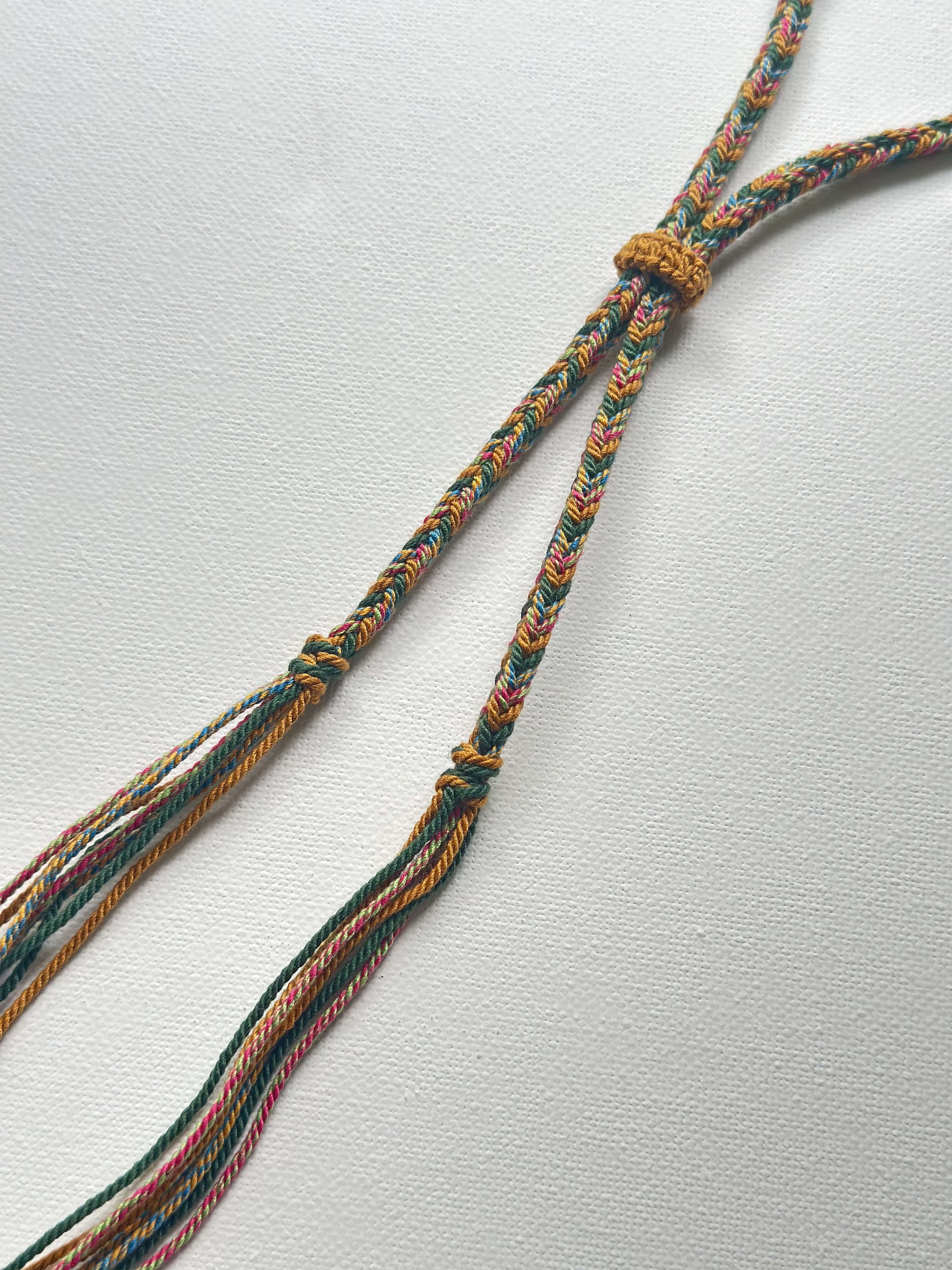 Heavily Handwoven Necklace with metal accessories and Nine-Eyed DZI pendant