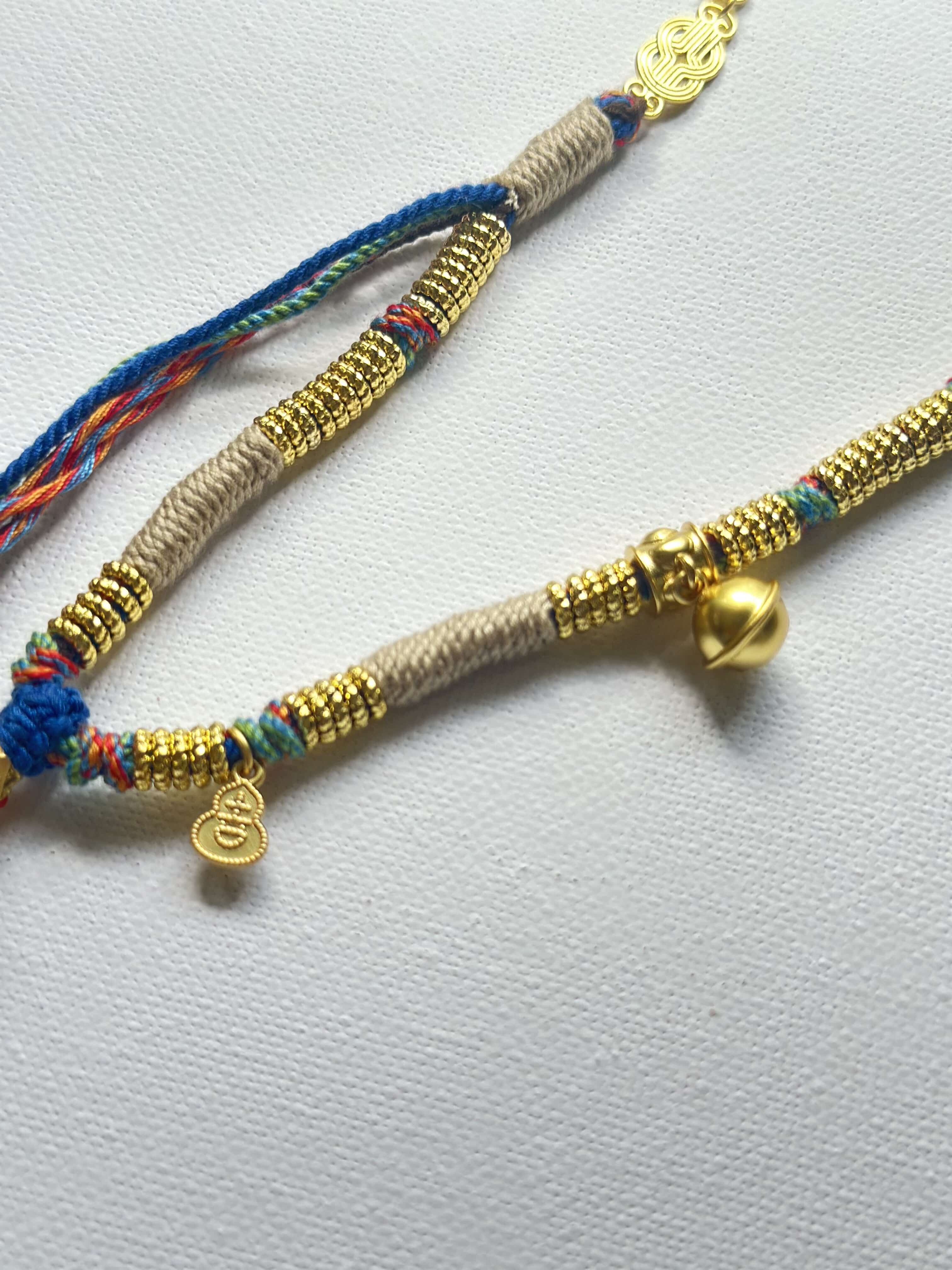 Heavily handwoven necklace with Gold plated metal lucky accessories and Vintage Nine-Eyed DZI bead pendant.
