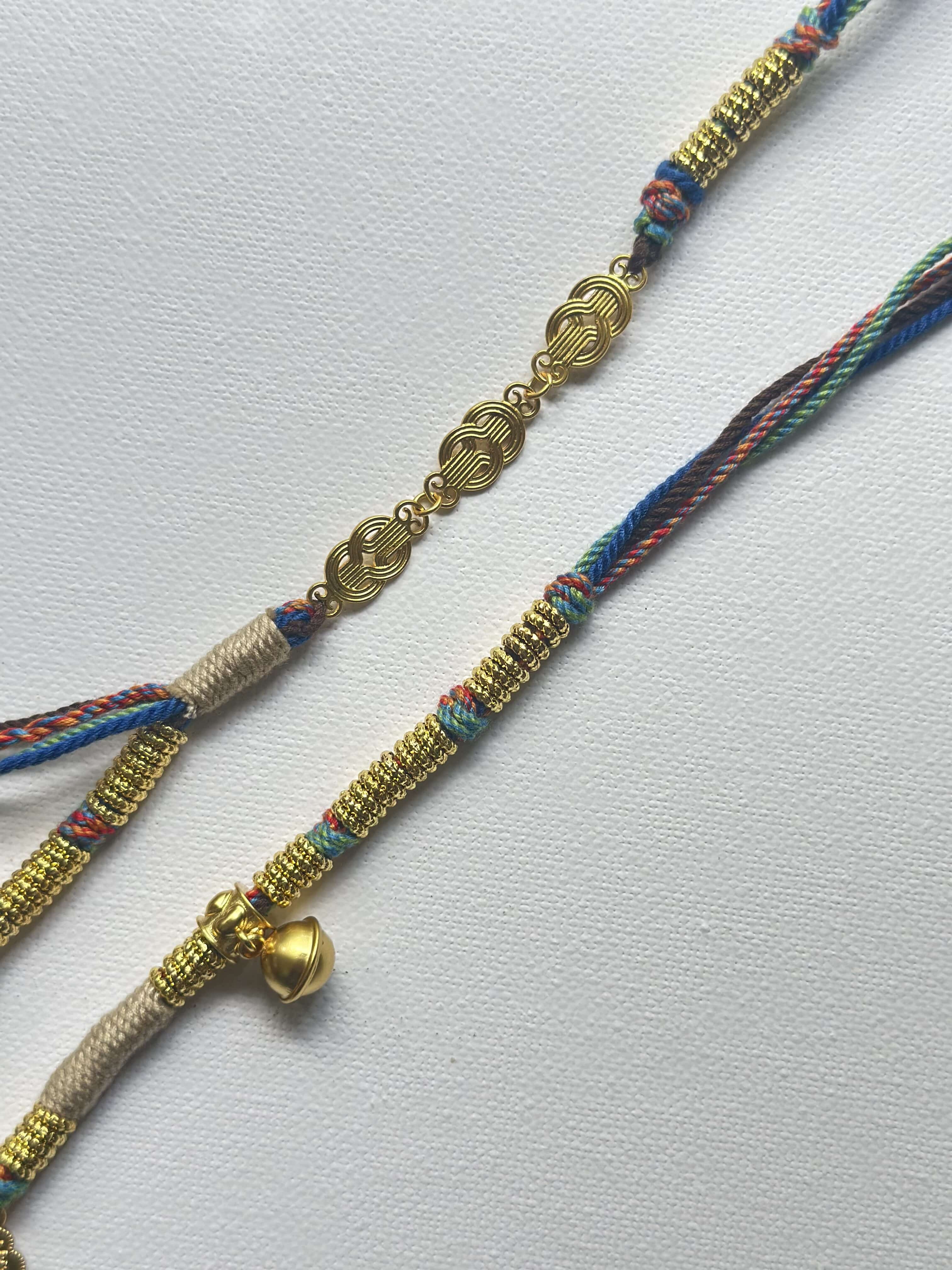 Heavily handwoven necklace with Gold plated metal lucky accessories and Vintage Nine-Eyed DZI bead pendant.