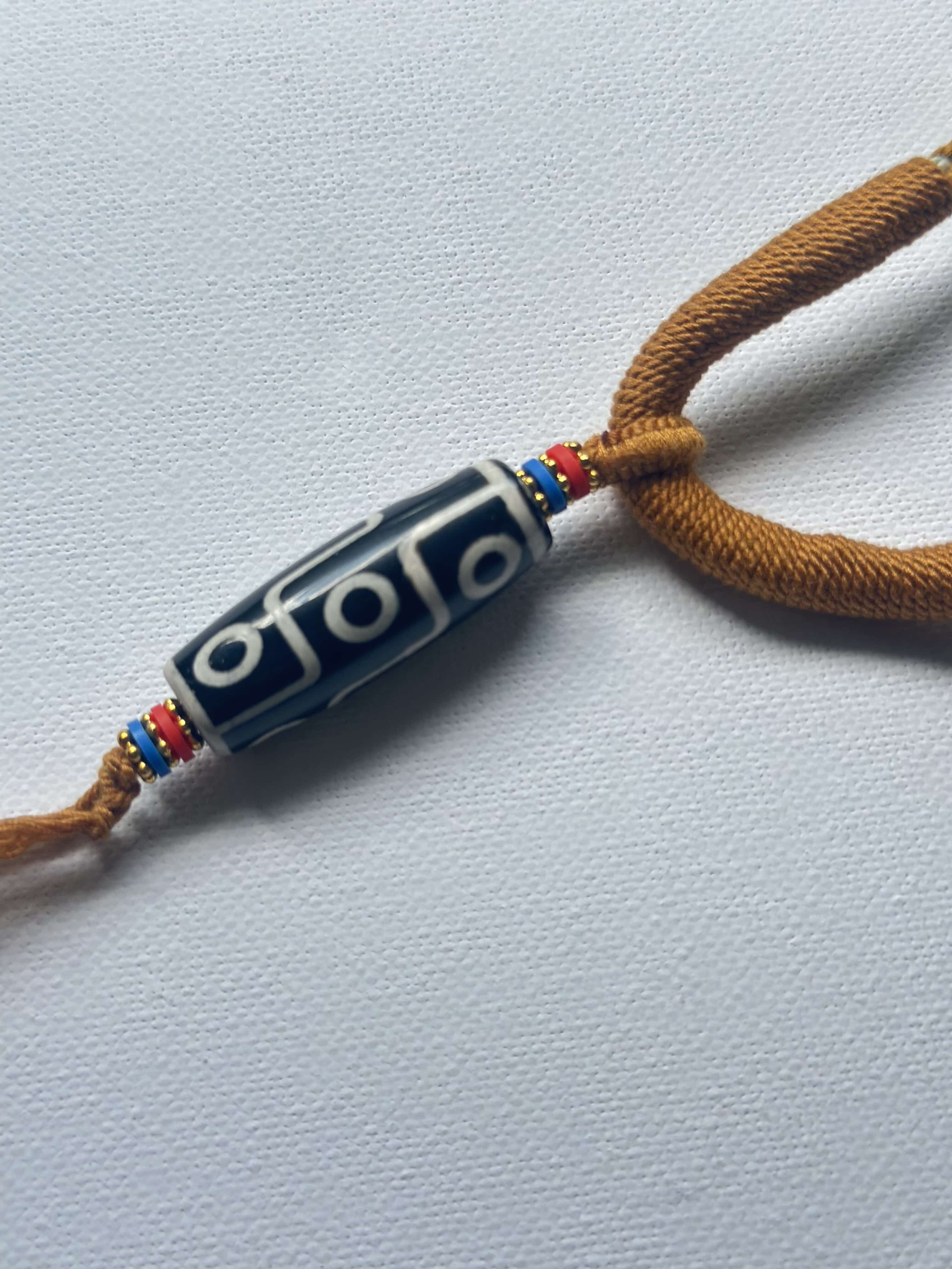Heavily Handwoven Necklace with five metal lucky color plates and agate Nine-eyed DZI bead.