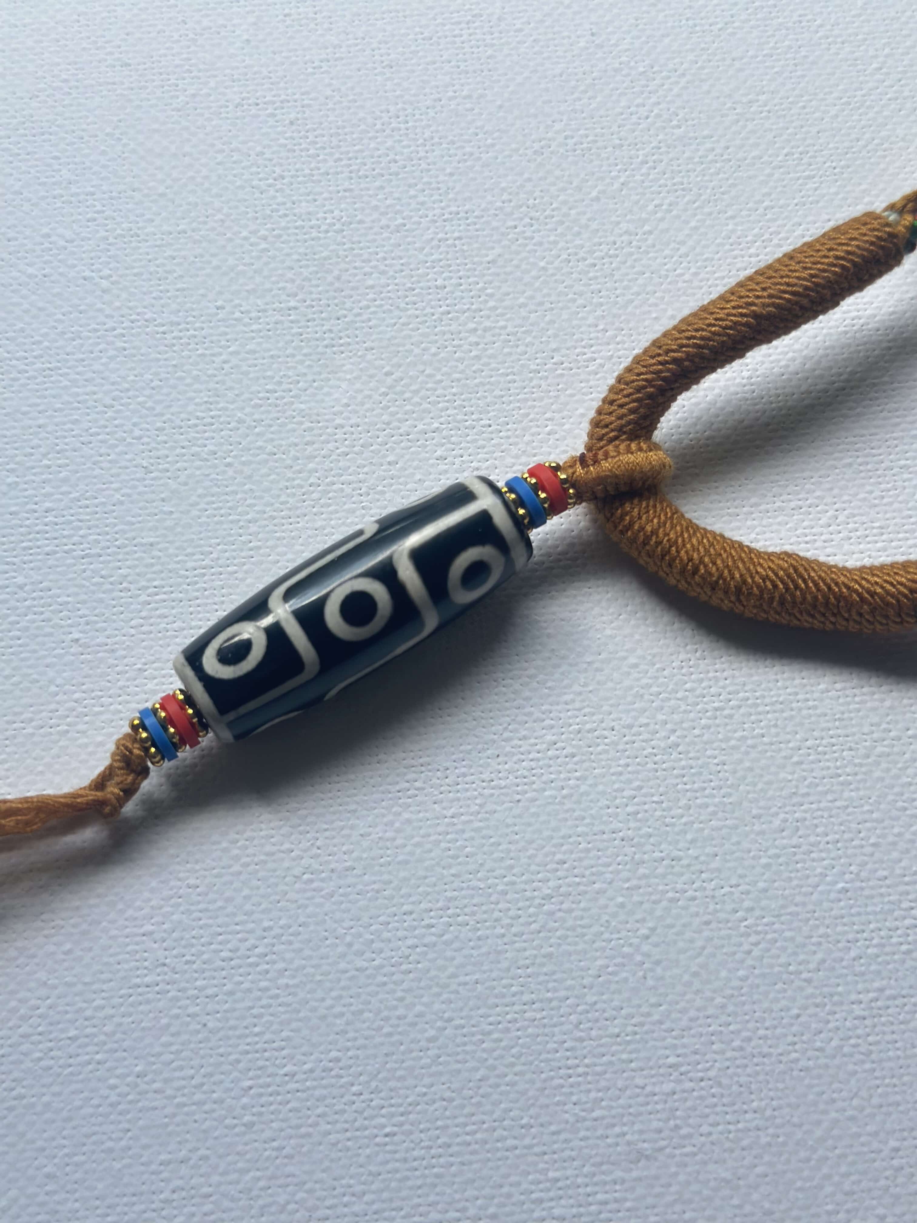 Heavily Handwoven Necklace with five metal lucky color plates and agate Nine-eyed DZI bead.
