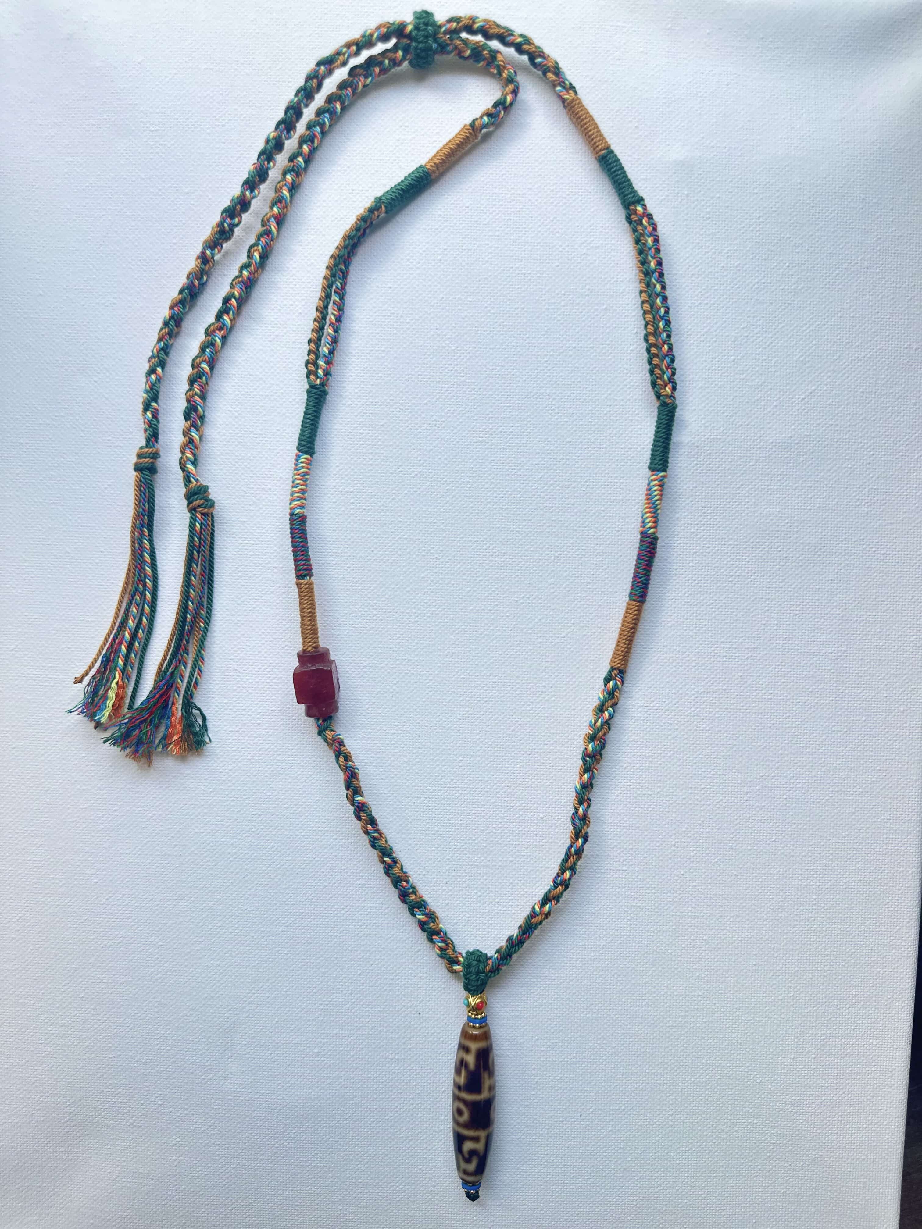 Heavily Handwoven Necklace with handmade carnelian bead and vintage Three-Eyed Dzi of Guru Rinpoche pendant.