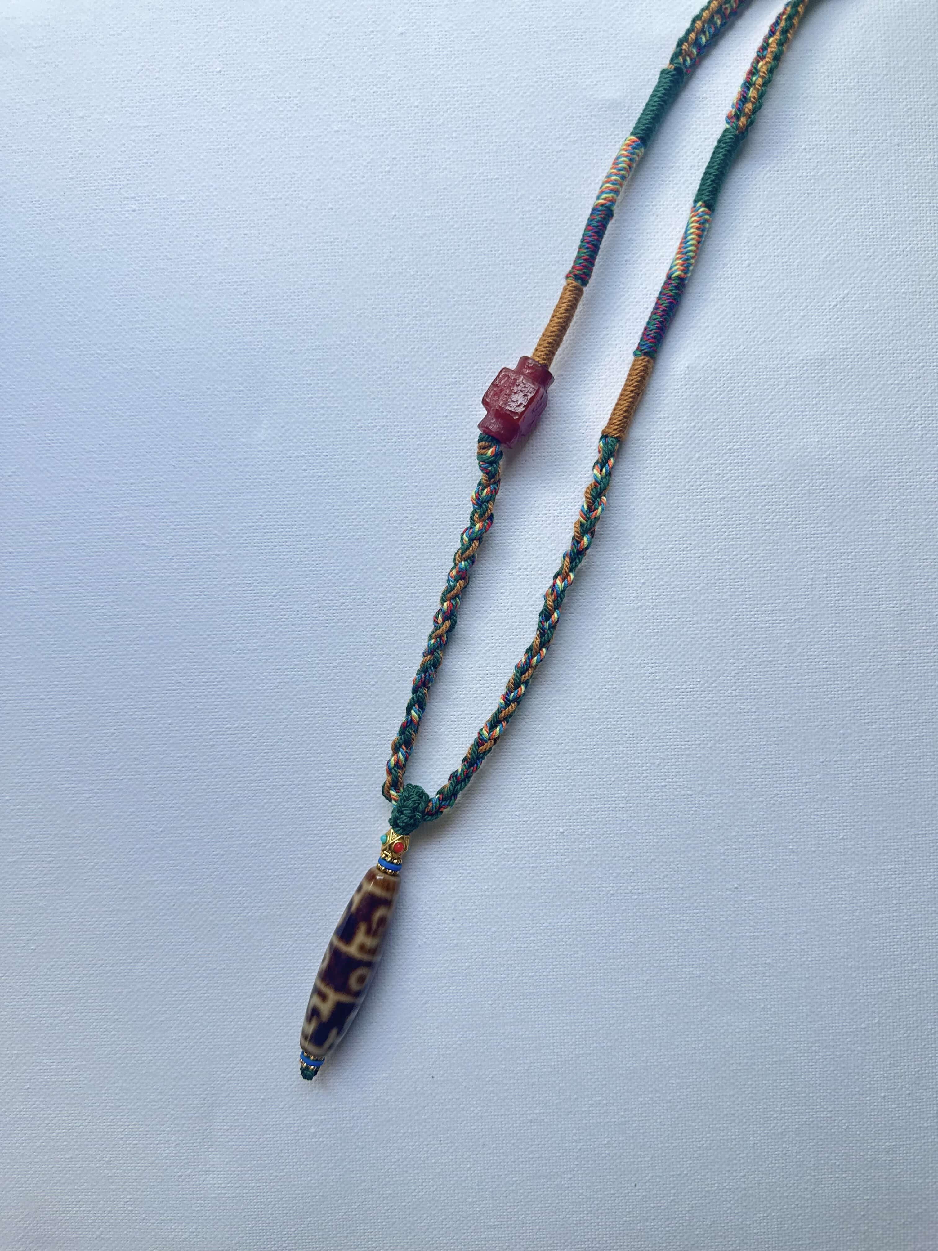 Heavily Handwoven Necklace with handmade carnelian bead and vintage Three-Eyed Dzi of Guru Rinpoche pendant.