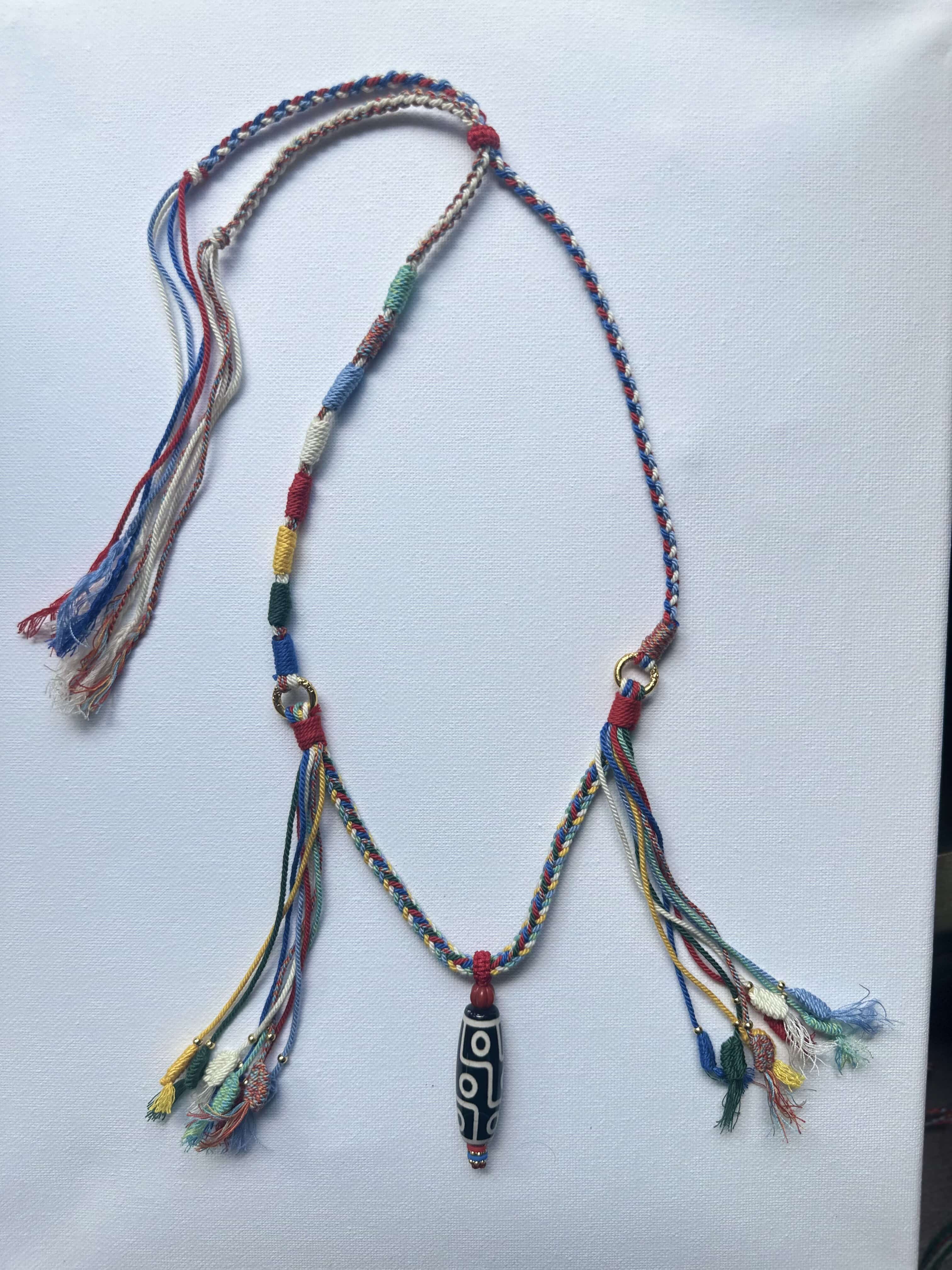 Heavily Handwoven necklace with nine-eyed DZI pendant