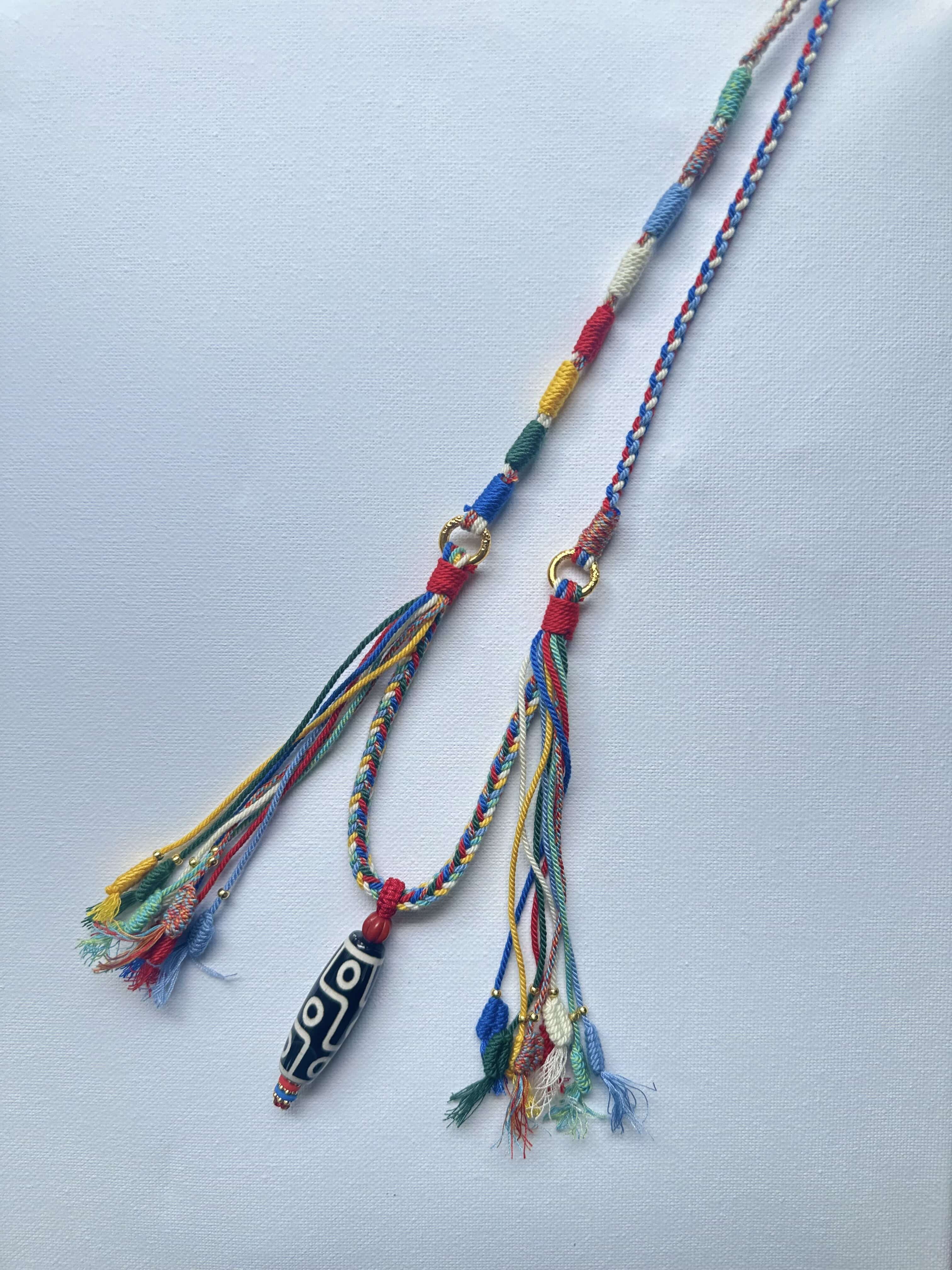 Heavily Handwoven necklace with nine-eyed DZI pendant