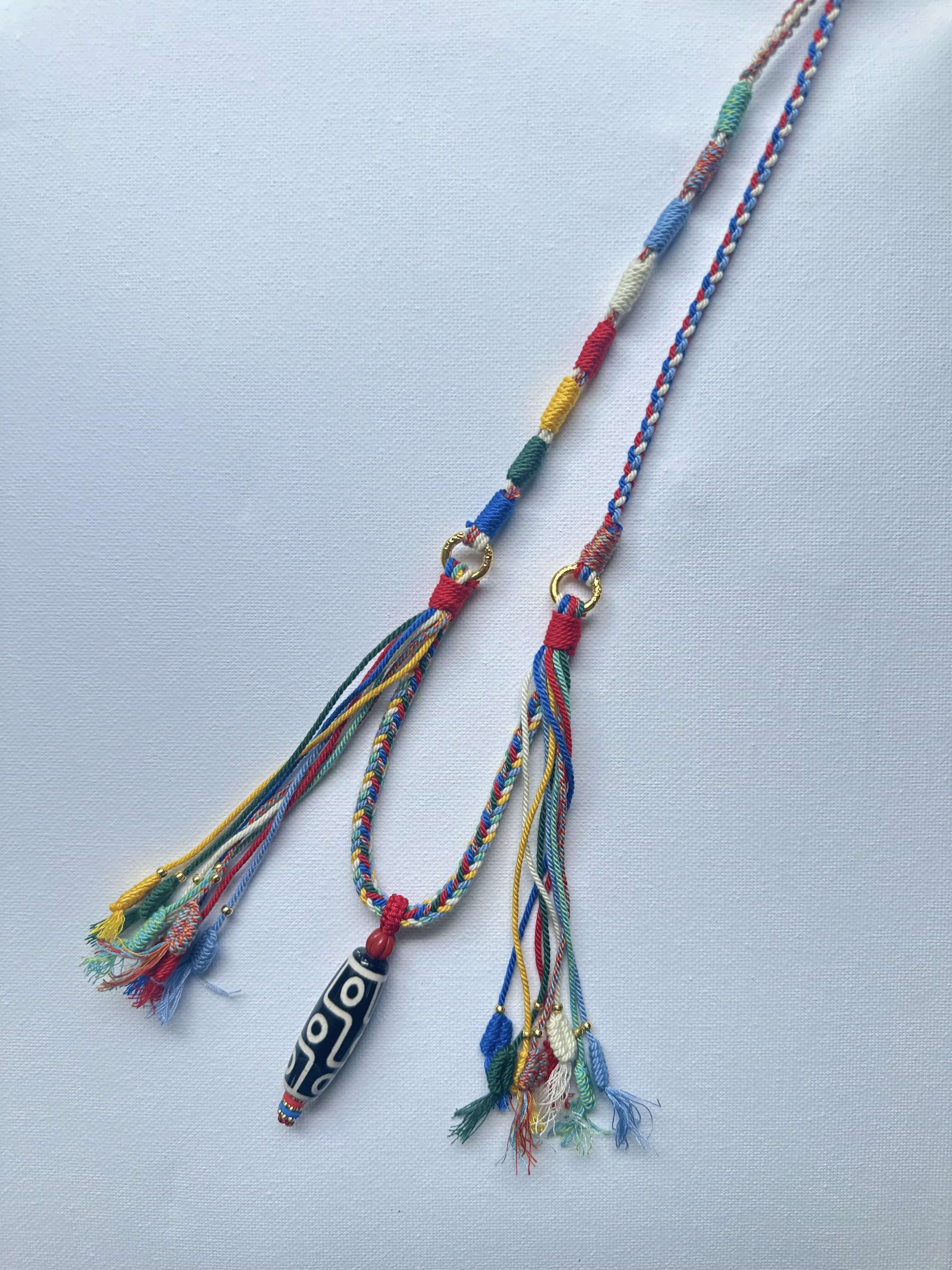 Heavily Handwoven necklace with nine-eyed DZI pendant