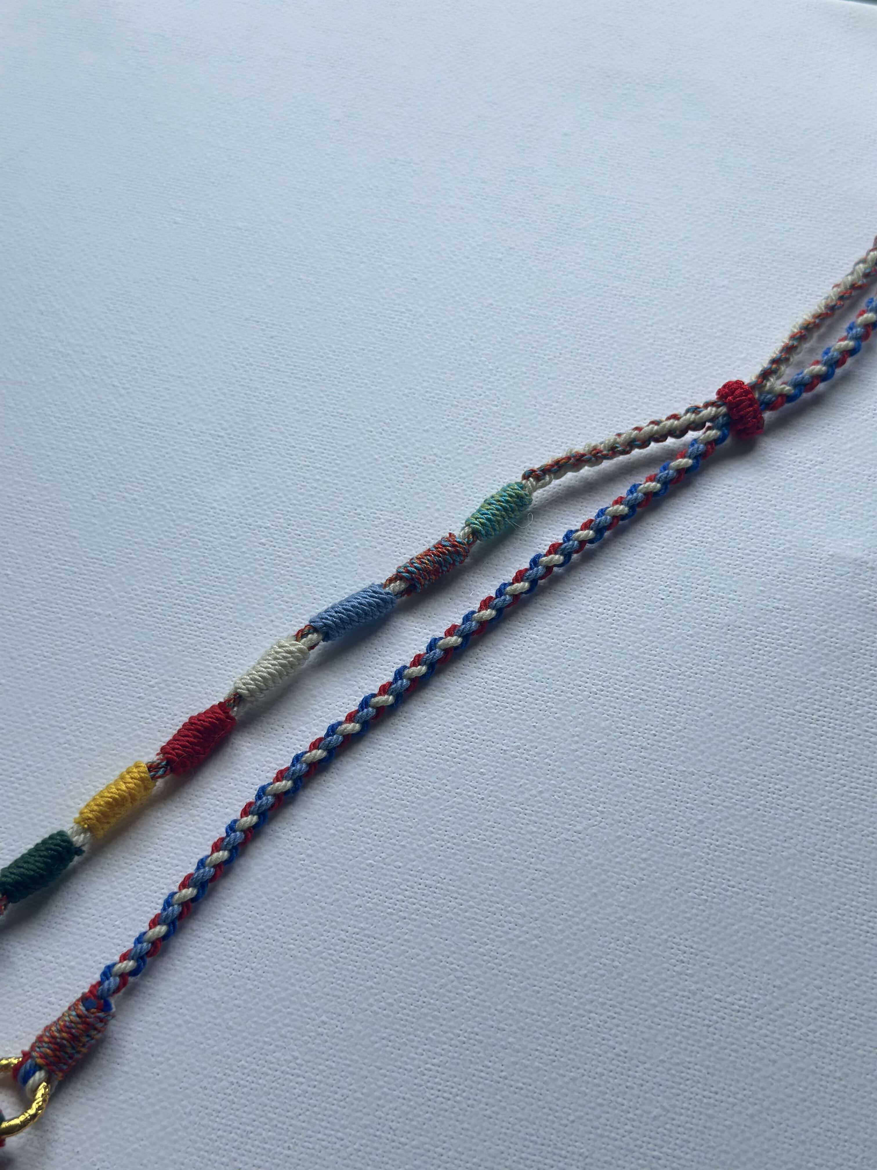 Heavily Handwoven necklace with nine-eyed DZI pendant
