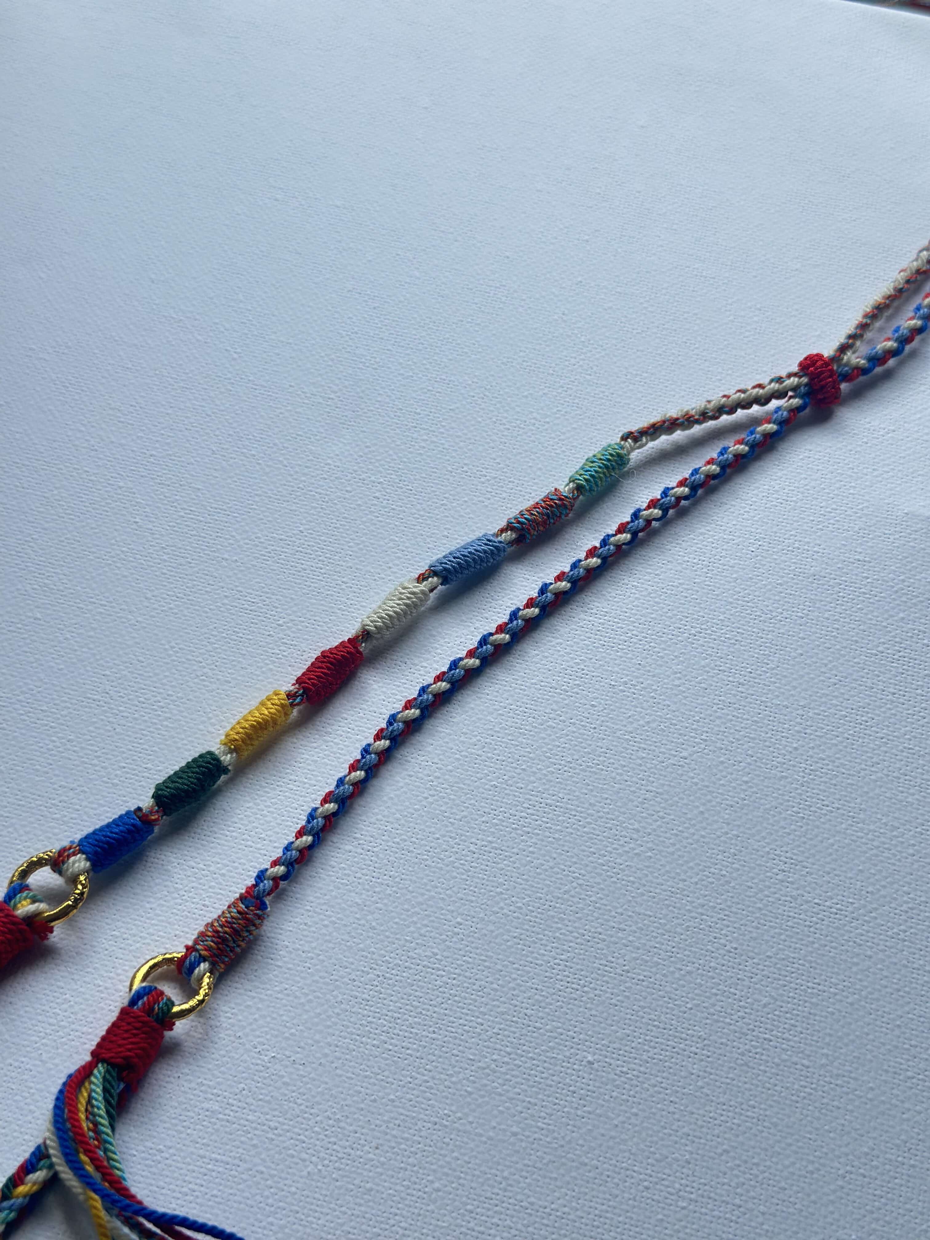 Heavily Handwoven necklace with nine-eyed DZI pendant