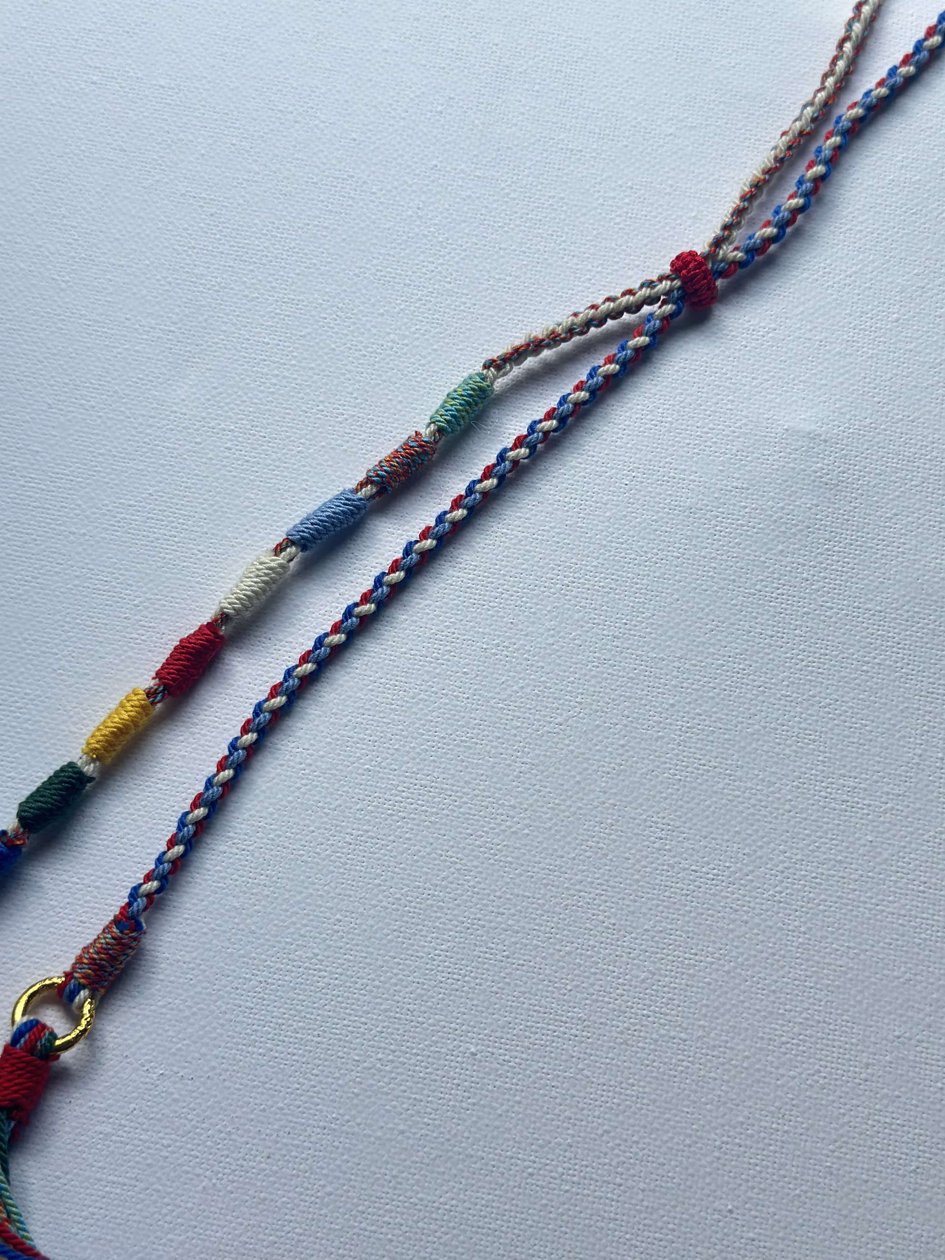 Heavily Handwoven necklace with nine-eyed DZI pendant