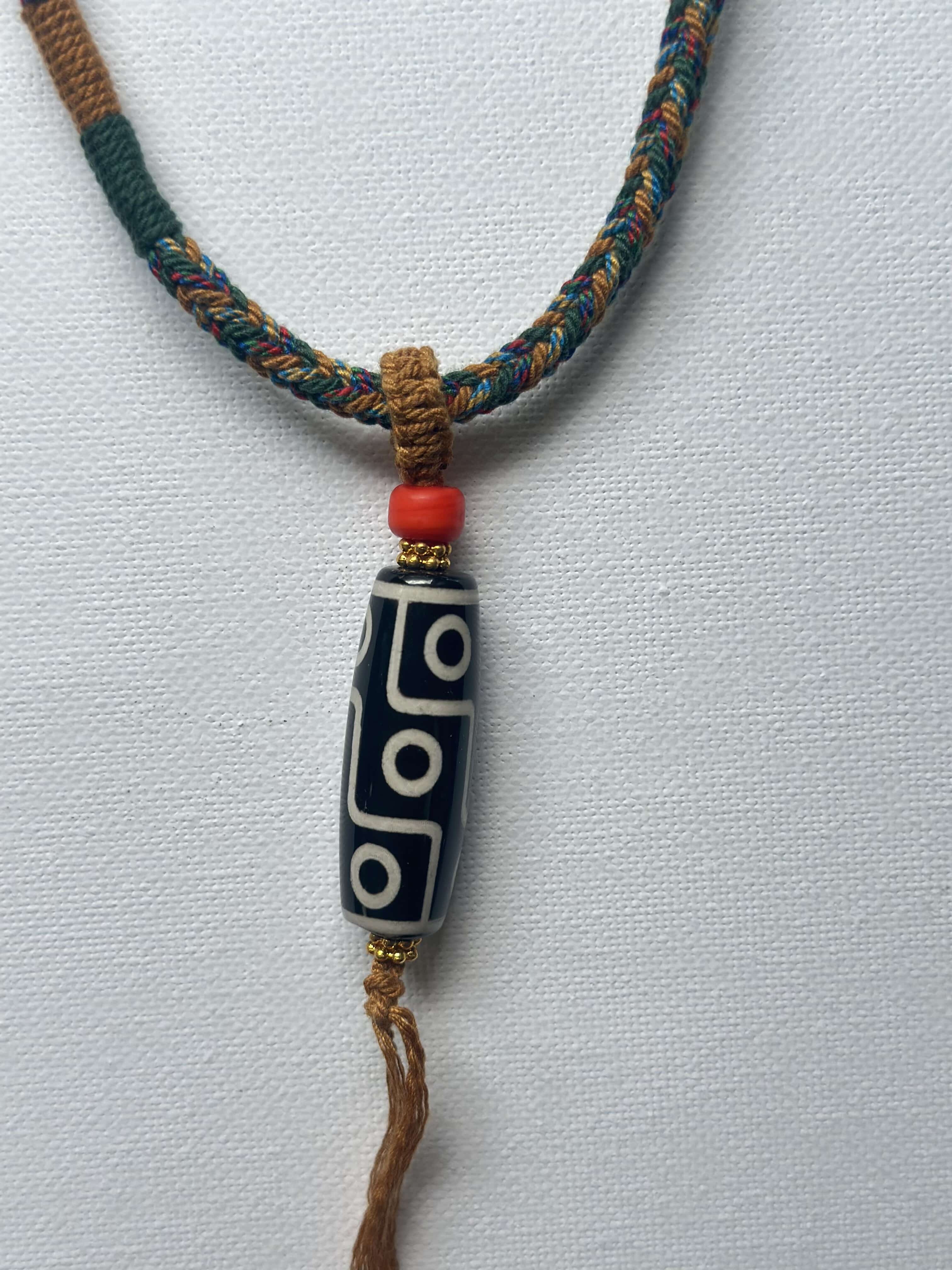 Heavily Handwoven necklace with vintage metal Himalayan accessories and nine-eyed DZI bead