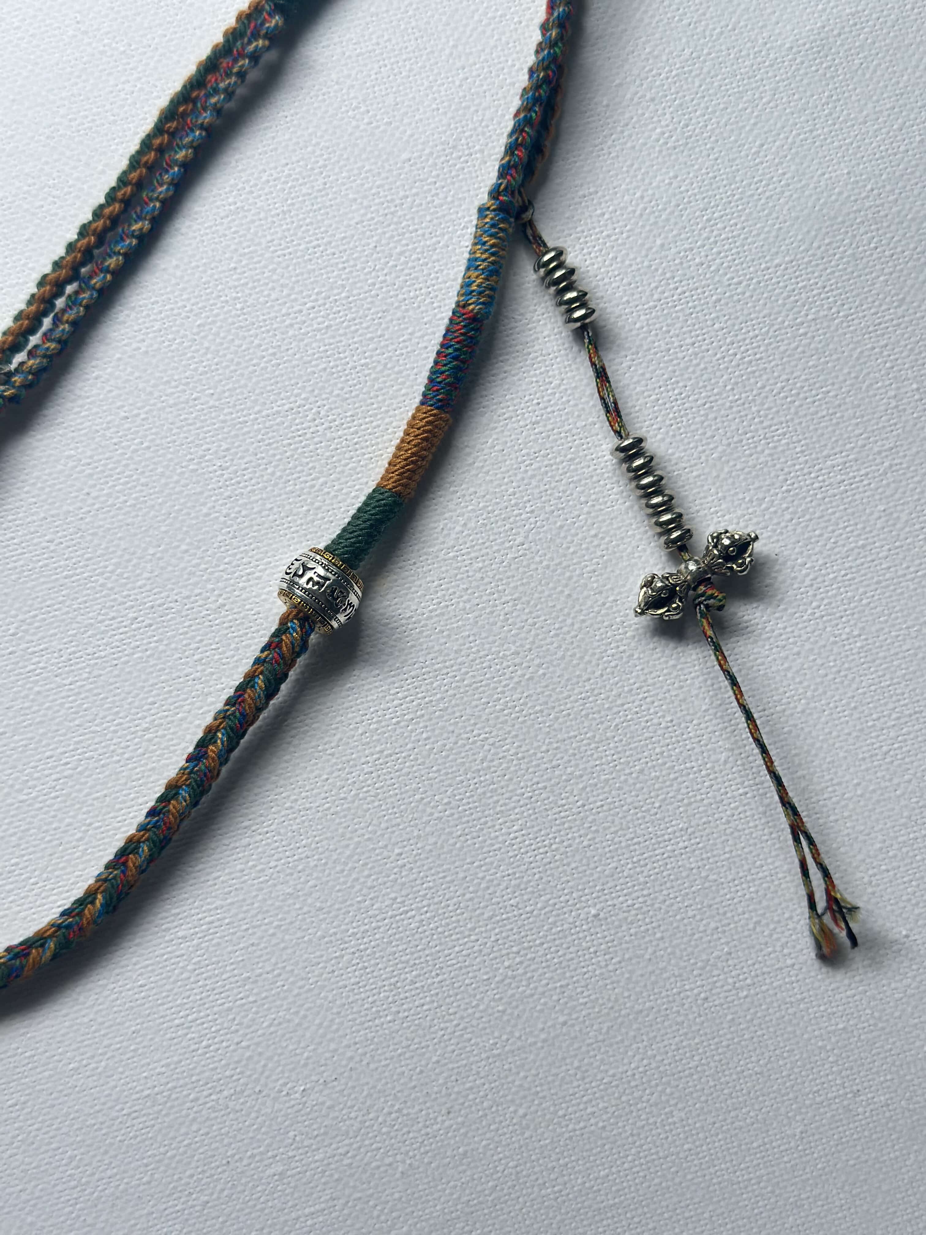 Heavily Handwoven necklace with vintage metal Himalayan accessories and nine-eyed DZI bead