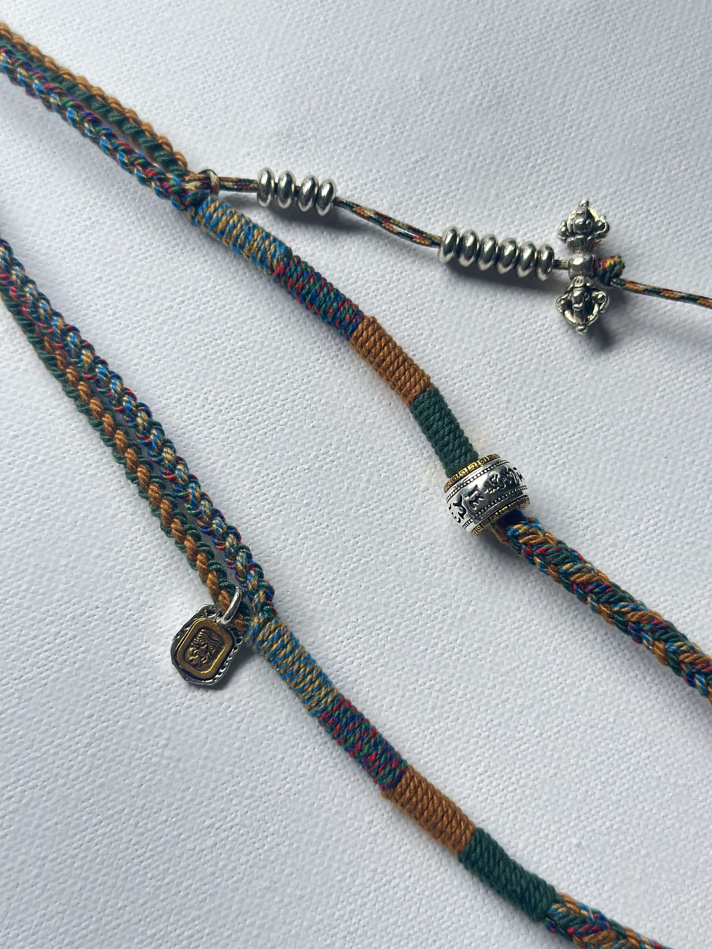Heavily Handwoven necklace with vintage metal Himalayan accessories and nine-eyed DZI bead