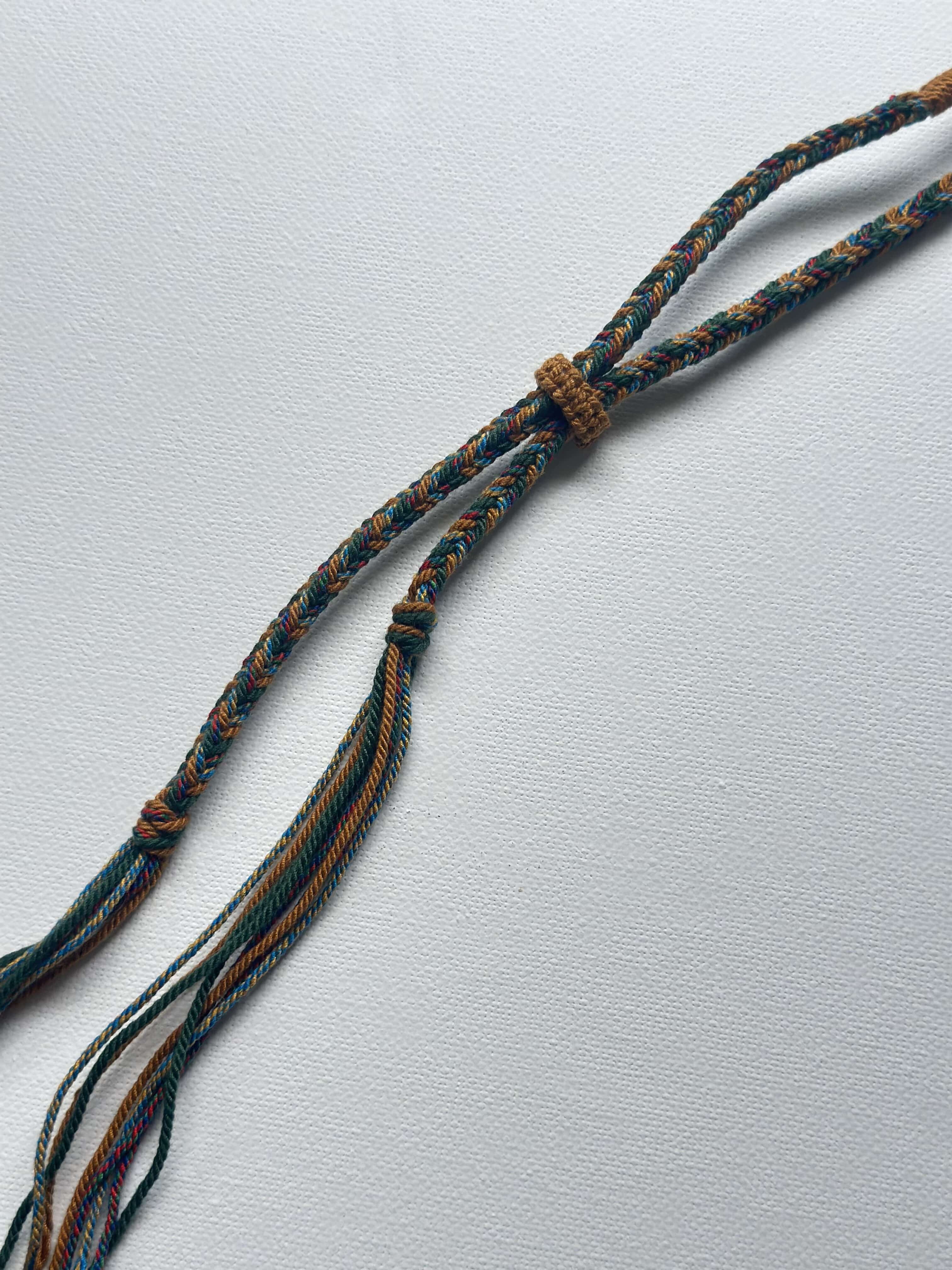 Heavily Handwoven necklace with vintage metal Himalayan accessories and nine-eyed DZI bead