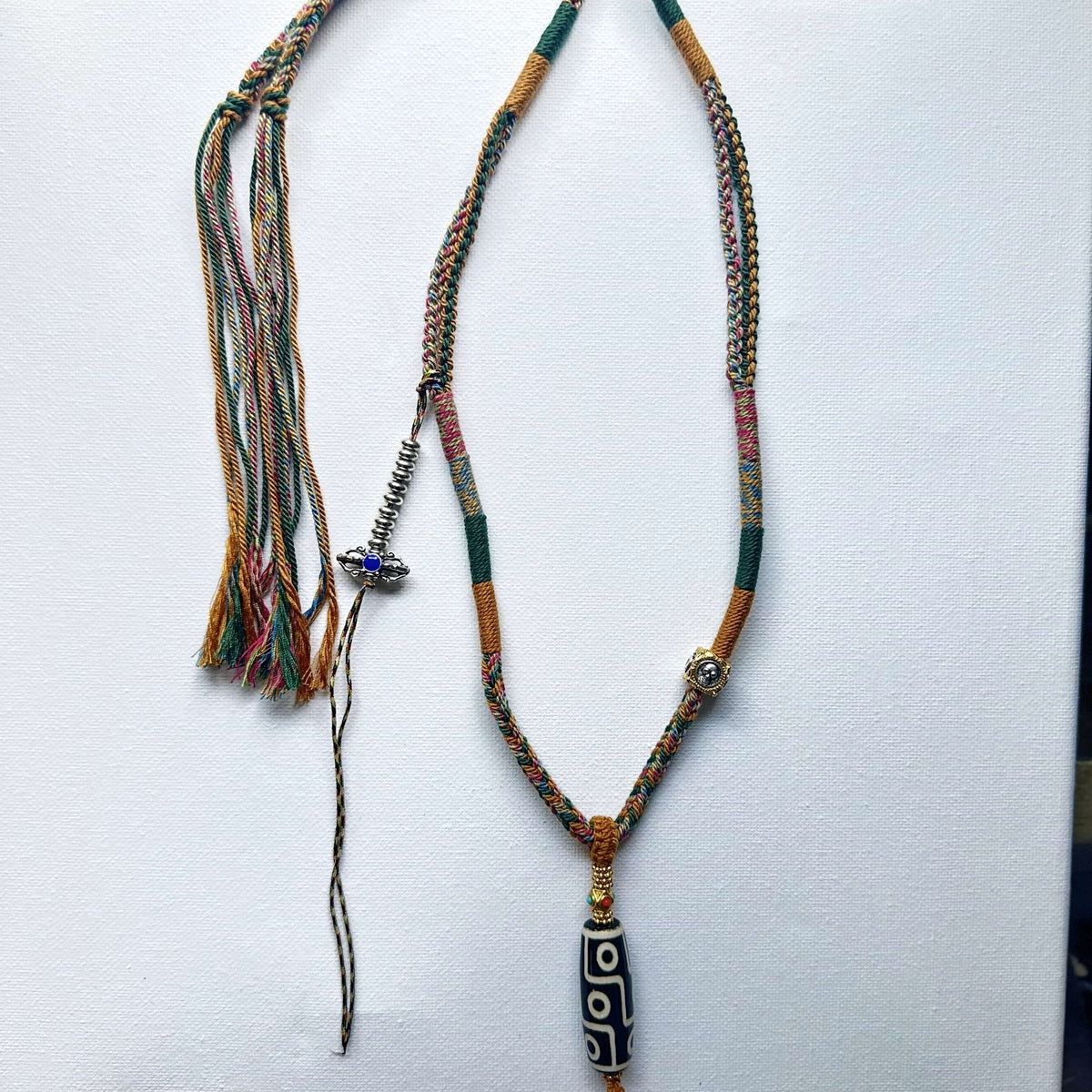 Heavily Handwoven Necklace with metal accessories and Nine-Eyed DZI pendant