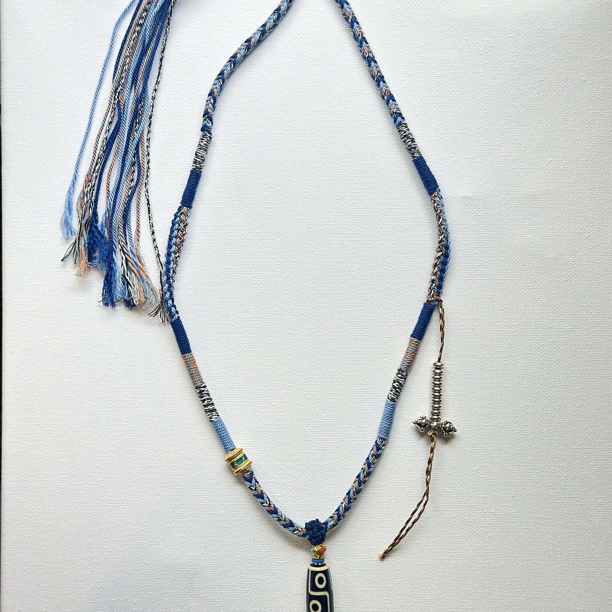 Heavily Handwoven Necklace with metal accessories and Nine-Eyed DZI pendan
